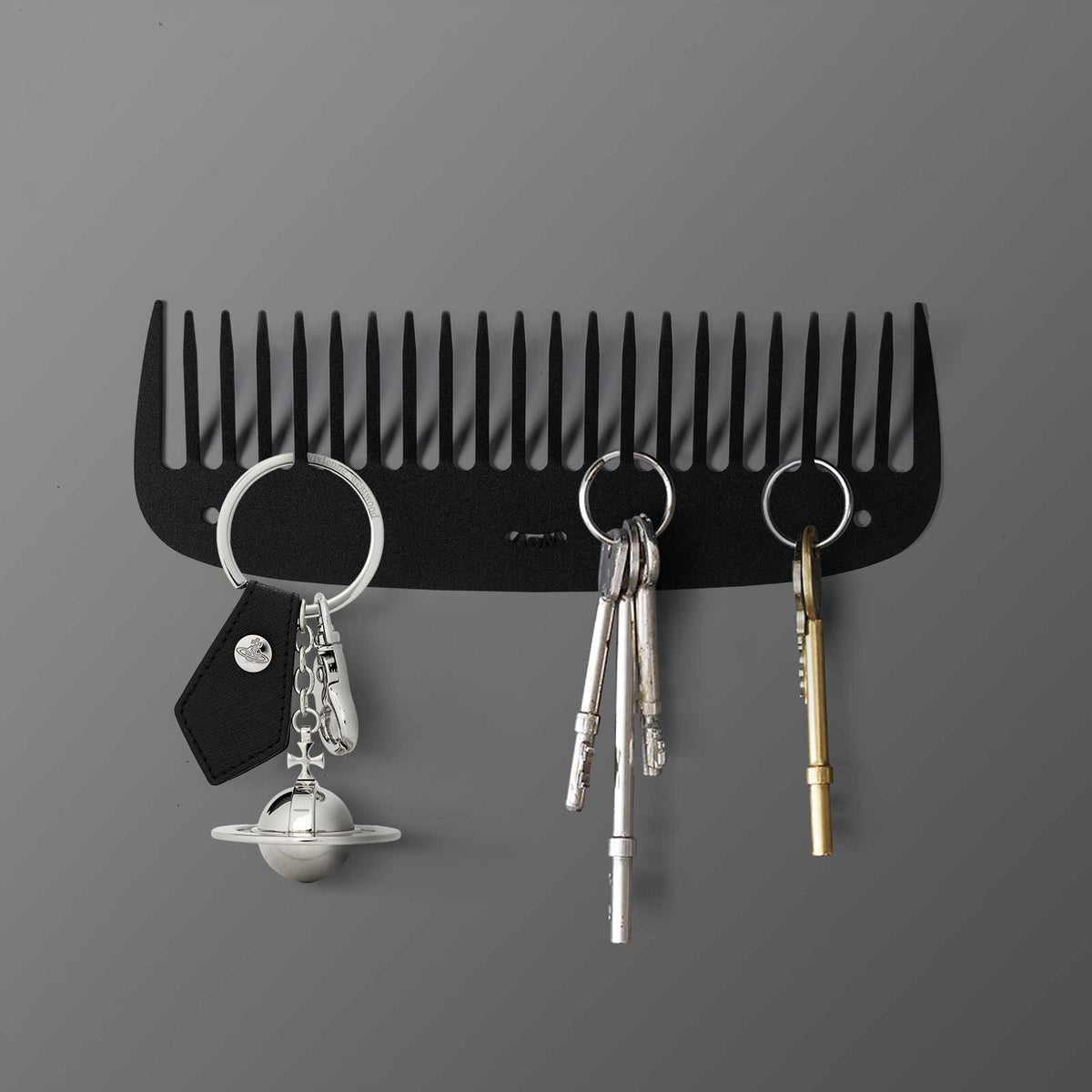 Nuovo porta chiavi a forma di pettine, colore nero