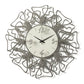 Vista frontale dell'orologio Linea di Arti&Mestieri, intrecci laser e numeri sovrapposti fango, quadrante avorio